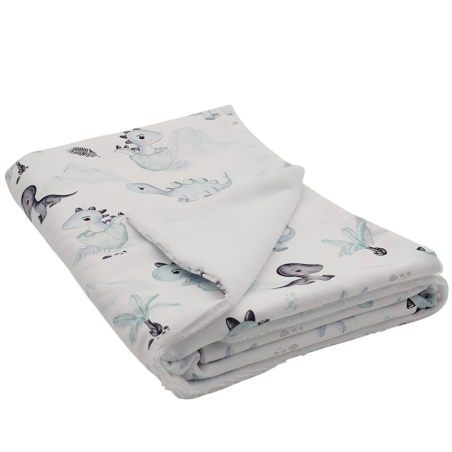 Manta arrullo para bebe estampado dinos azul en petitmandarina.com